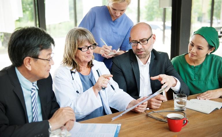 Hospital managers face demotion and pay cuts under cost-saving plans